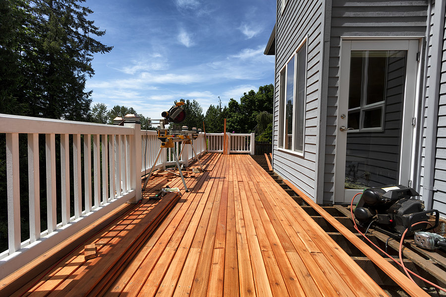 Outdoor wooden deck with grill